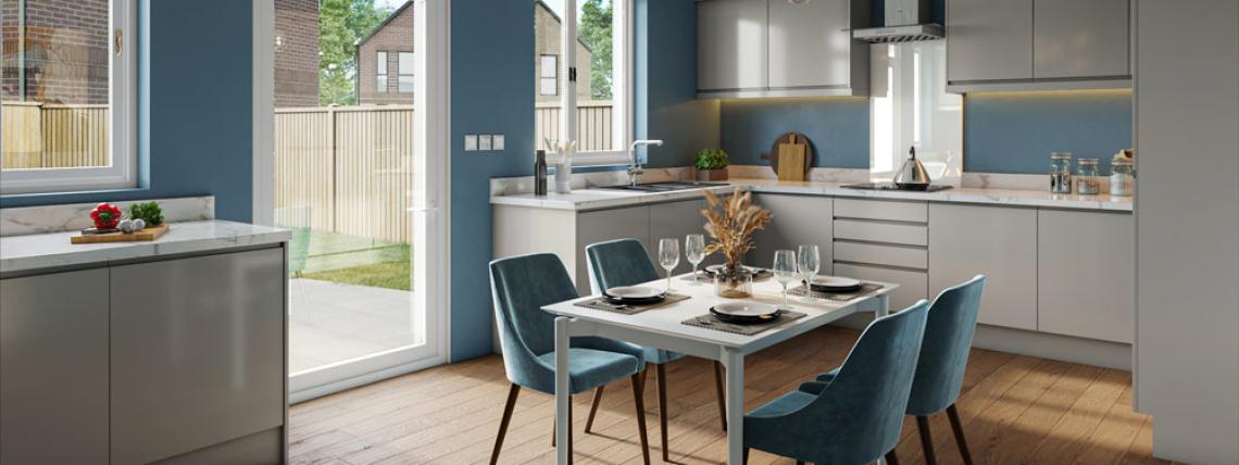 A large open plan kitchen and dining area with patio doors leading into the garden