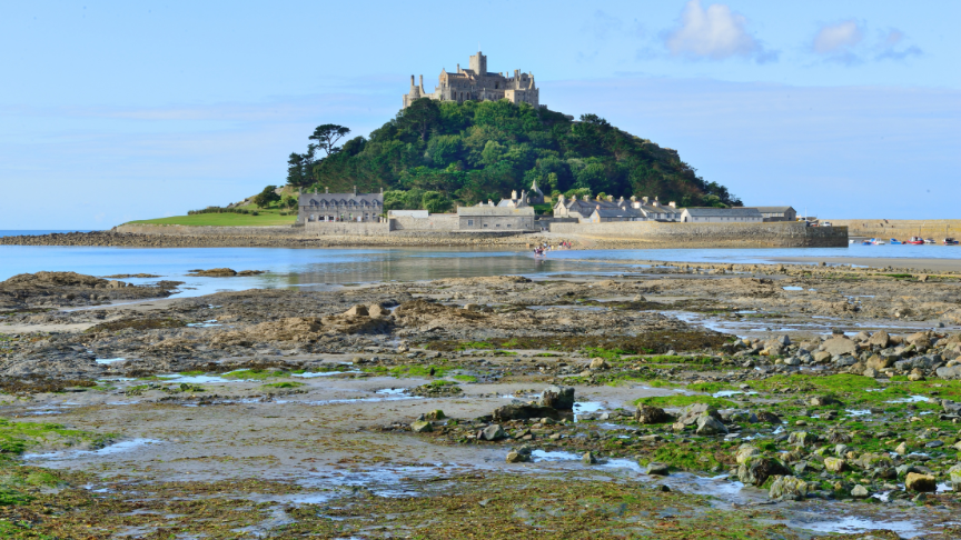 St Michael's Mount in Penzance with the tide out and blue sky