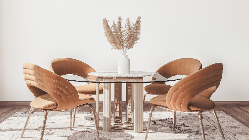 A minimal room with a glass dining table and trendy dining chairs
