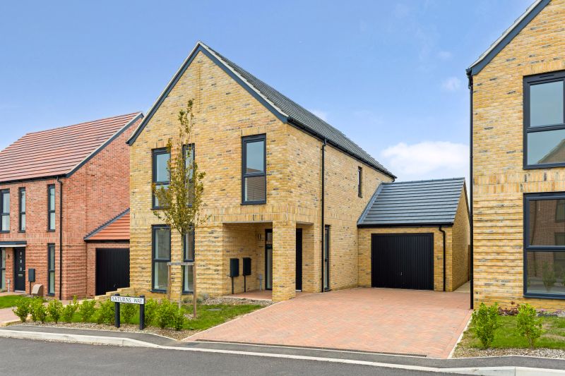 Modern brick home with driveway and garage in at a new-build development in Essex.
