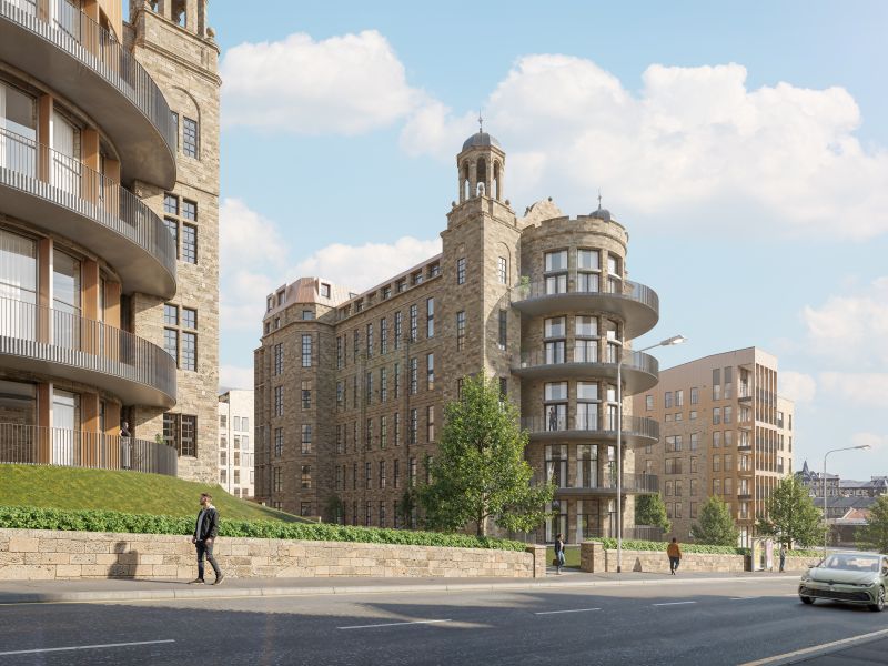 Street view of The Nightingale Collection featuring a historic stone building with rounded balconies and a central tower, surrounded by modern apartments. 