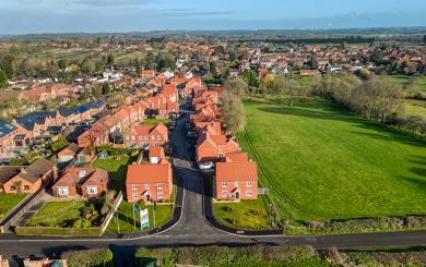 An aerial view of the Orchardside development next to an open field