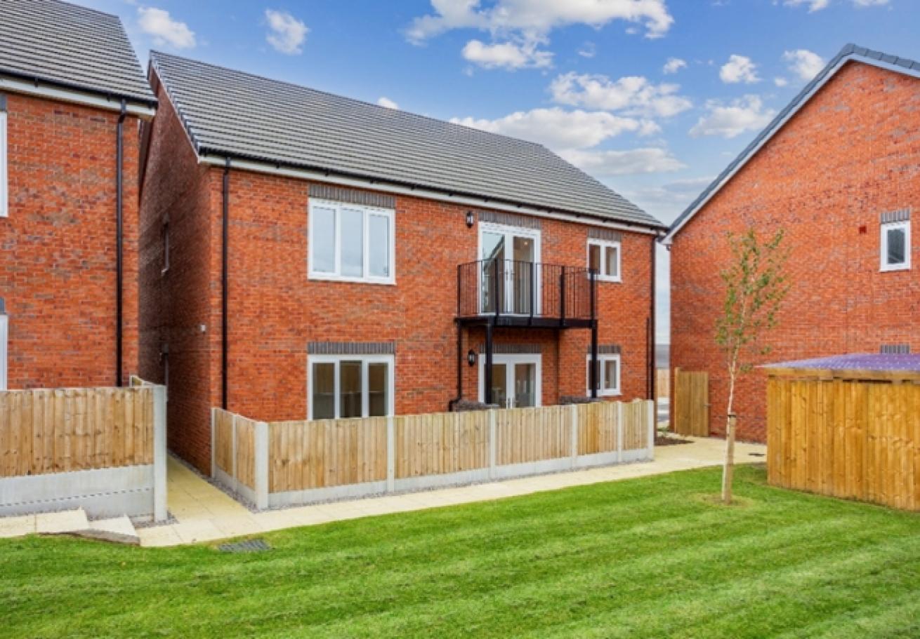 Exterior image of the back of plot 12 of The Willos showing the communal back garden area 