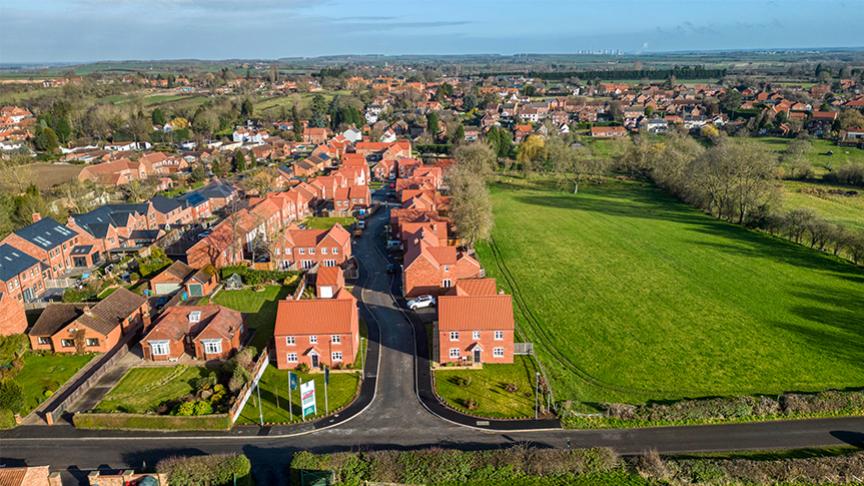 An aerial view of the Orchardside development next to an open field