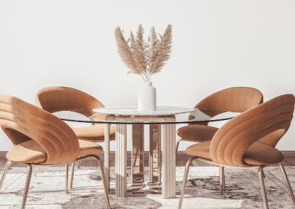 A minimal room with a glass dining table and trendy dining chairs 